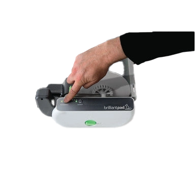 BrilliantPad Pro,"Hand pressing button on open pad dispenser"