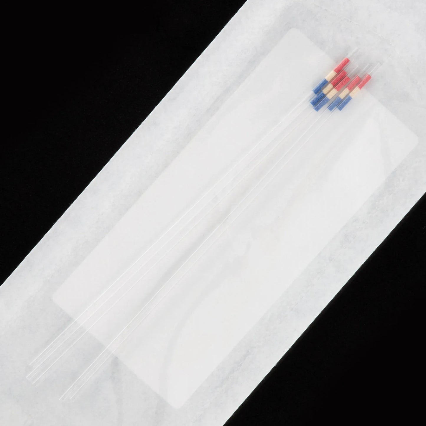 IMV CRISTAL .25CC RADIATED STRAW,"Bundle of clear straws with red and blue plugs"