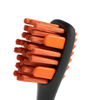 BrushMate Premium Toothbrush with Biteblock,"Close-up of toothbrush head with orange bristles and bite blocks"