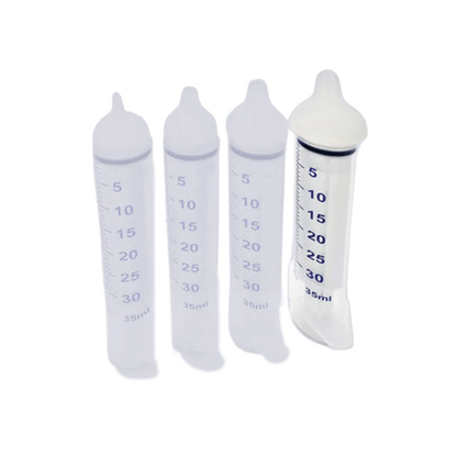 Puppywamer Latchons Syringe Nipple Feeders,"Four clear feeding syringes with white nipple tips"