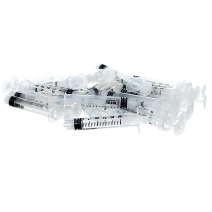 Small Syringes without Needles,"Pile of clear plastic syringes without needles"