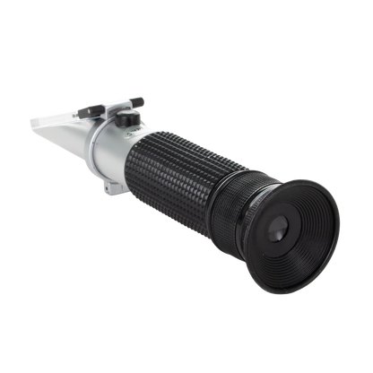Refractometer,"Handheld refractometer with black eyepiece and flip-top prism cover"