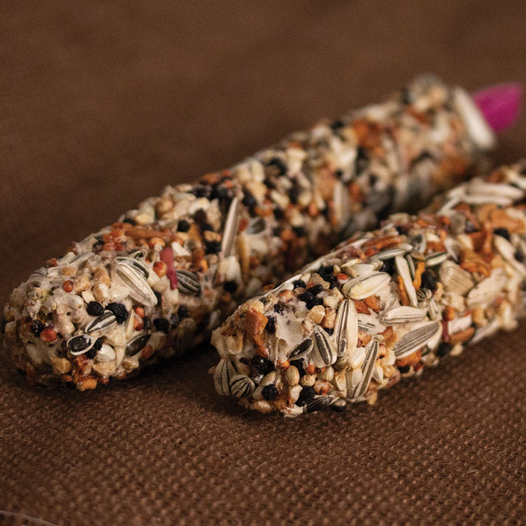 Smakers Treat Sticks,"Two seed-coated treat sticks close up"
