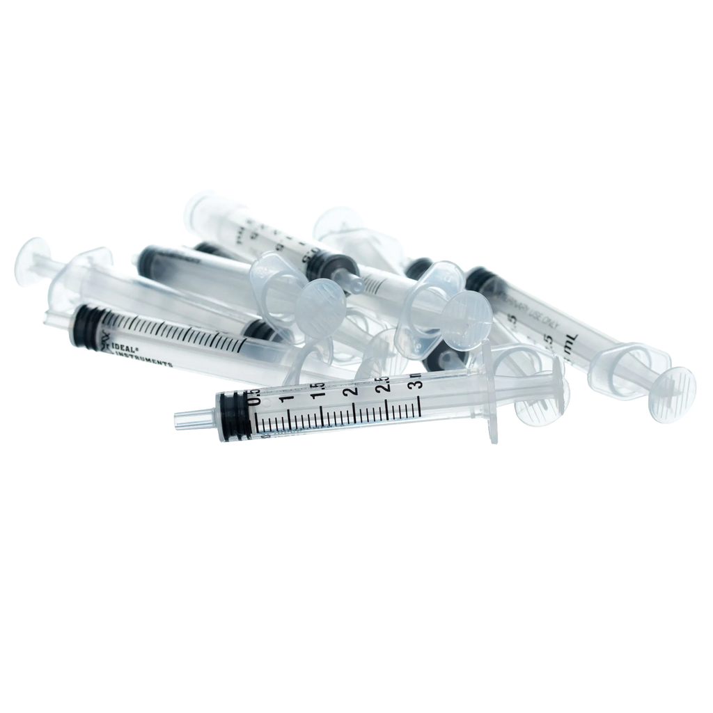 Small Syringes without Needles,"Clear plastic syringes with black plunger seals"
