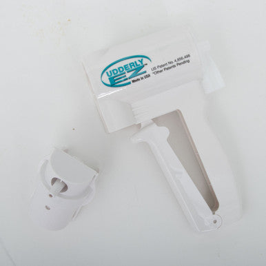 Udderly EZ Horse Milker,"White handheld milker with detached cup component"