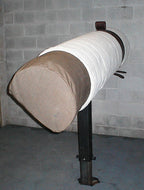 Fabric tunnel hanging on black metal stand,"Fabric tunnel suspended from black metal stand"