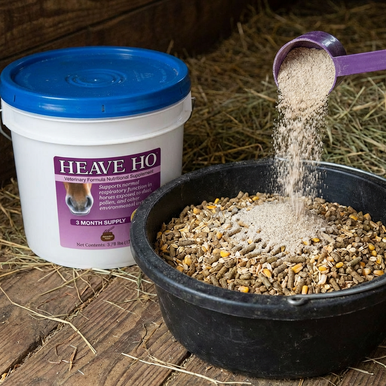 Heave Ho™,"White supplement tub with scoop pouring powder into feed bowl"