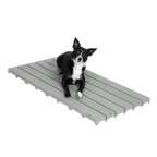 Kennel Deck®,"Gray slatted kennel deck with dog lying on top"