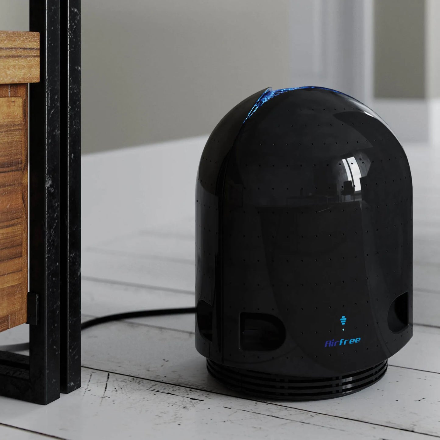 Airfree® Air Purifier,"Glossy black dome-shaped air purifier on floor"