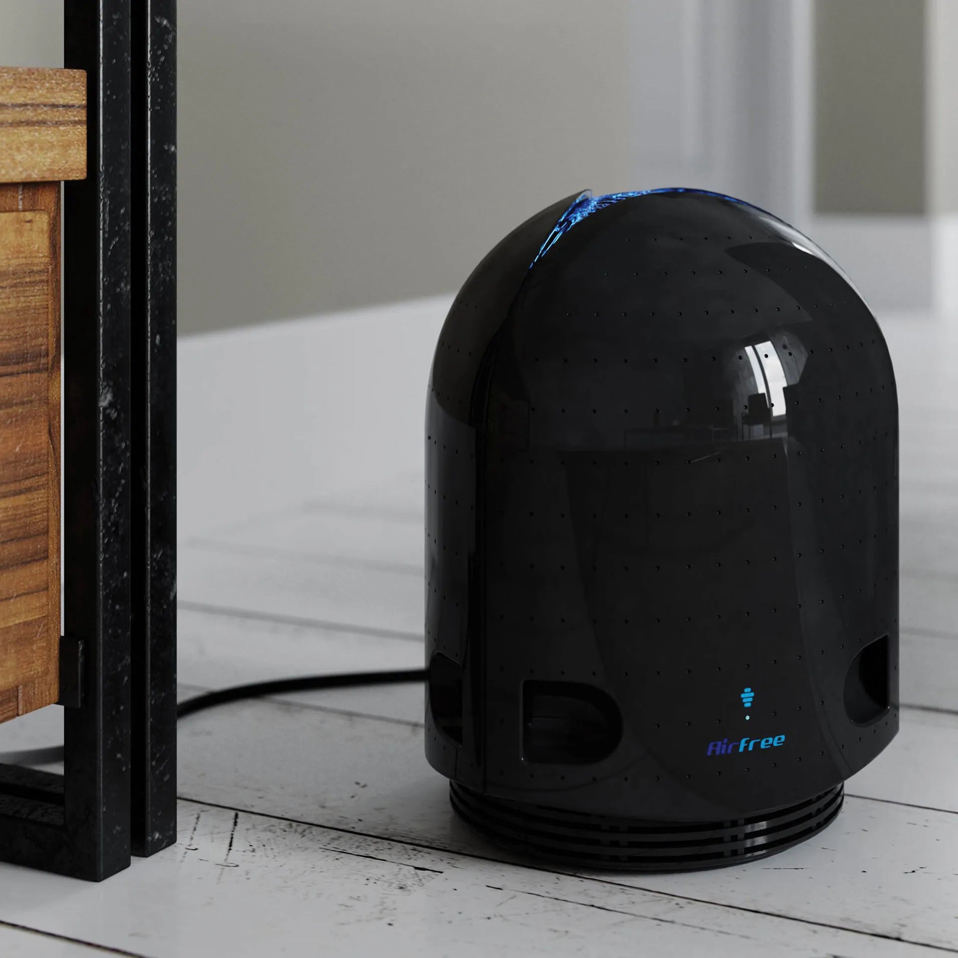Airfree® Air Purifier,"Glossy black dome-shaped air purifier on floor"