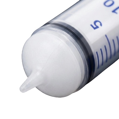 Puppywamer Latchons Syringe Nipple Feeders,"Close-up of syringe tip with white nipple feeder"
