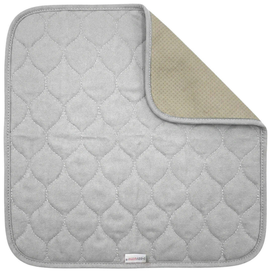 Puppywarmer Whelping Box Pad,"Gray quilted pad with corner folded to show textured backing"