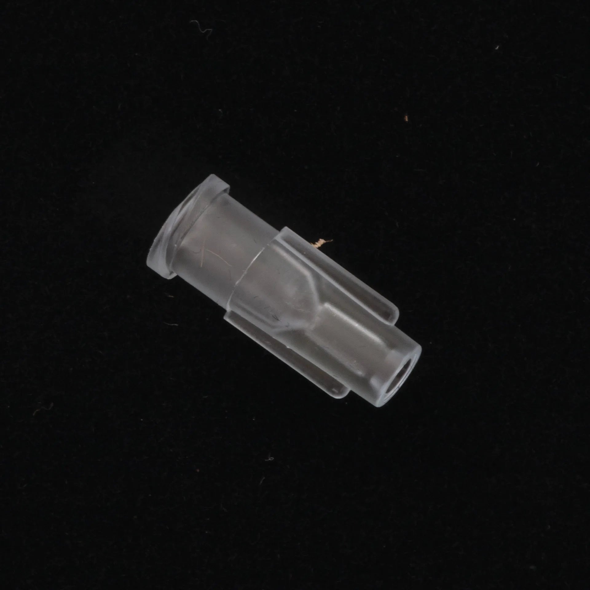 Straw Adapter,"Clear plastic adapter with flanged end and tapered nozzle"