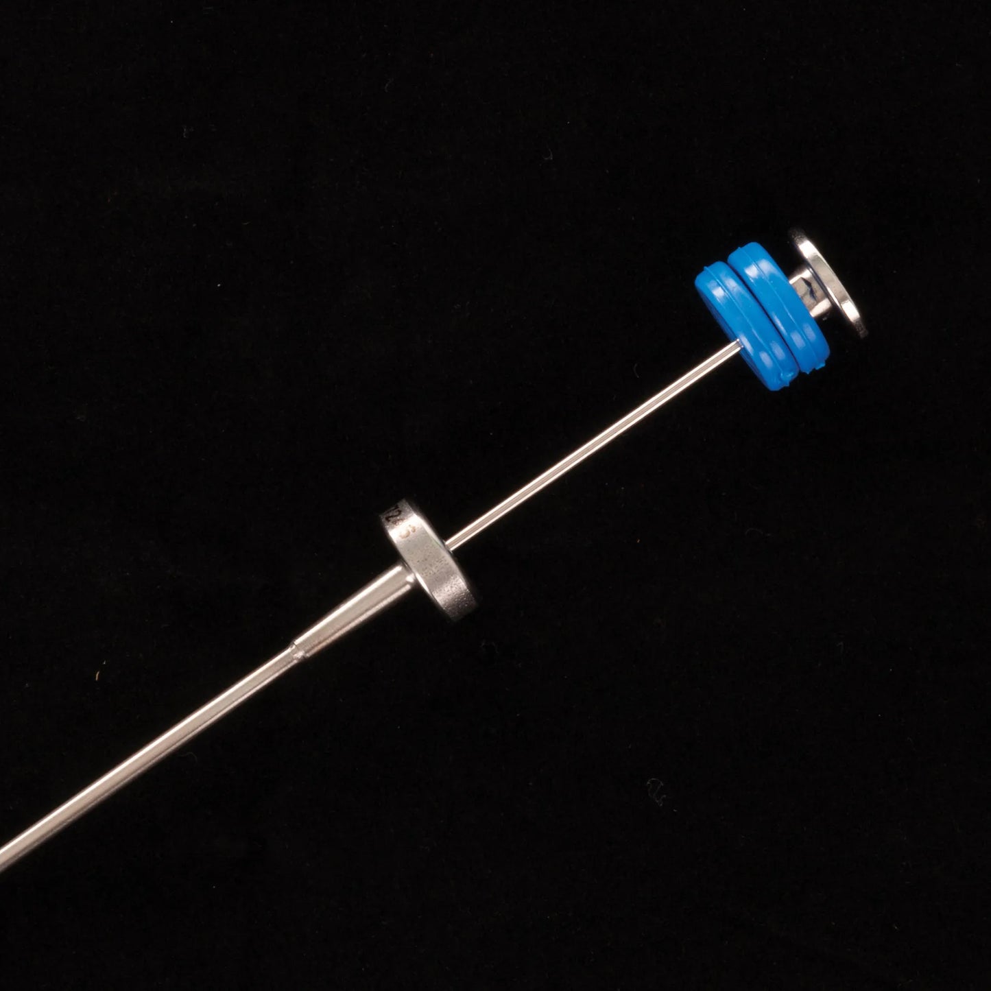 ET Syringe gun from IMV,"Metal syringe gun rod with blue plunger stopper"