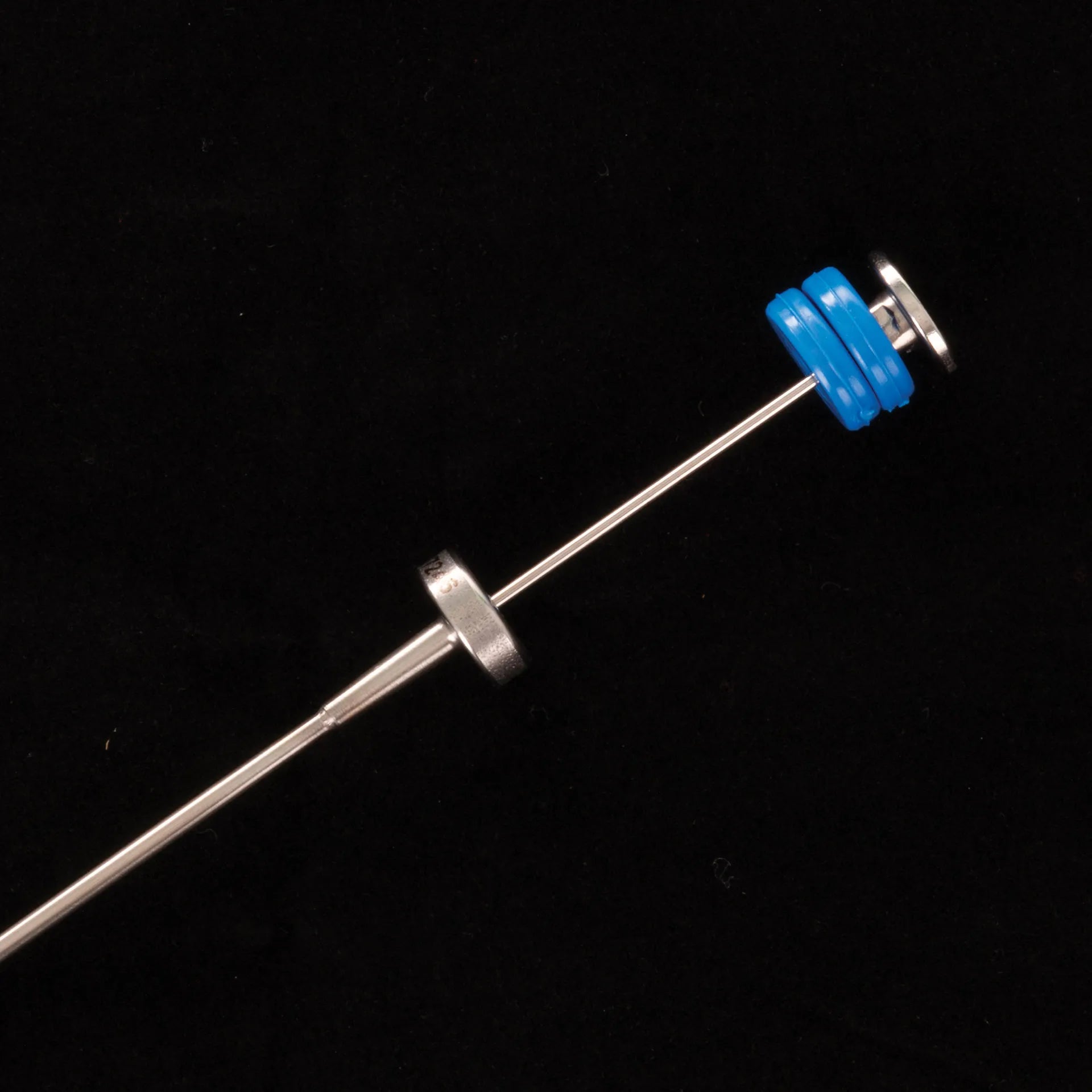 ET Syringe gun from IMV,"Metal syringe gun rod with blue plunger stopper"