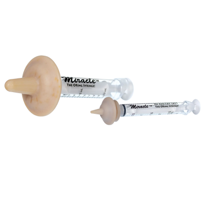 "The Miracle Nipple® for Kittens, Puppies, and Small Mammals","Two clear feeding syringes with beige rubber nipples"