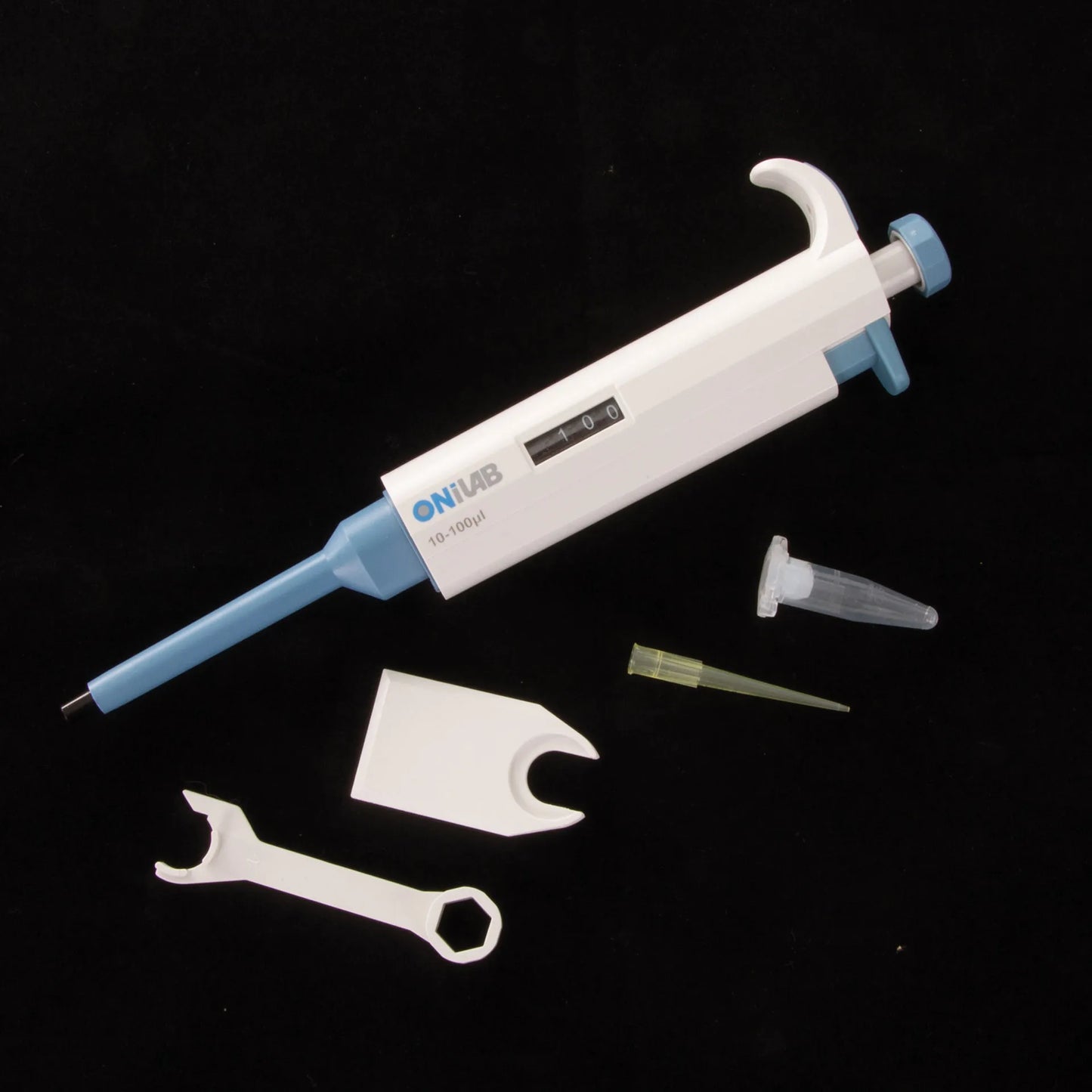 10-100ul Micropipettor,"White and blue micropipettor with tip and calibration tools"