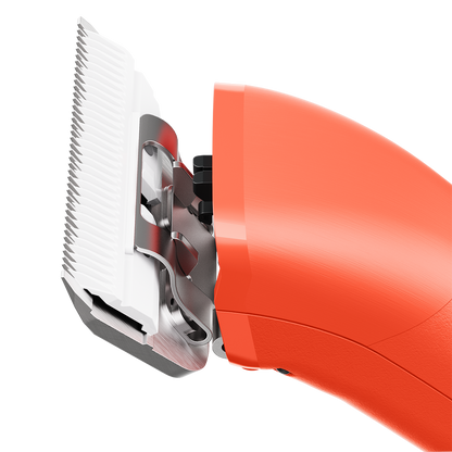 Emerge Clipper Orange with Wide 30 Blade,"Close-up of orange clipper with wide white blade"