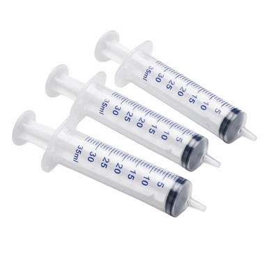 Puppywamer Latchons Syringe Nipple Feeders,"Three clear feeding syringes angled side by side"