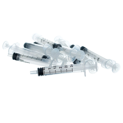 Small Syringes without Needles,"Loose pile of small clear syringes without needles"