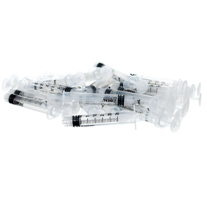 Small Syringes without Needles,"Pile of clear plastic syringes without needles"