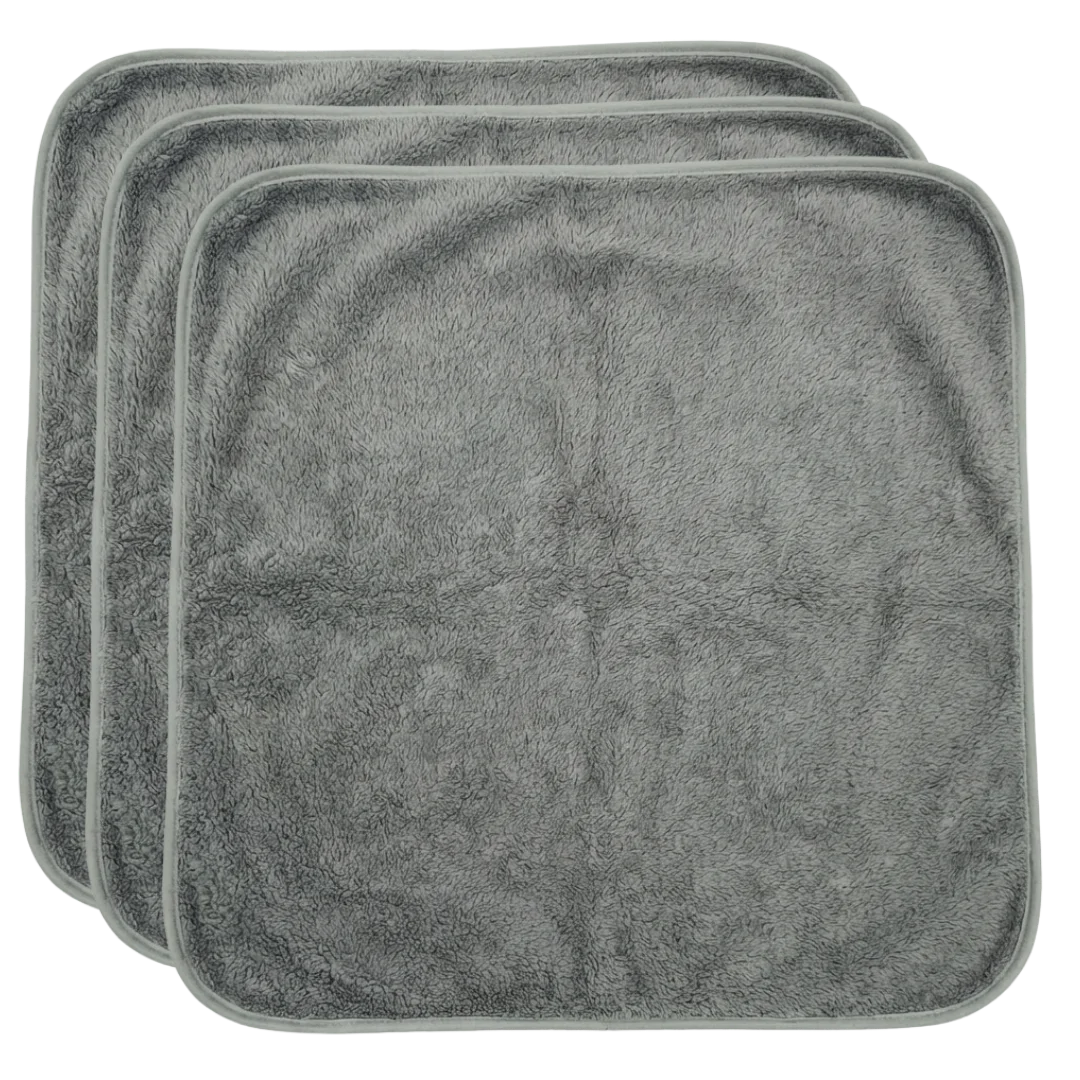 Puppywarmer Bundles,"Stack of three gray plush square pads"