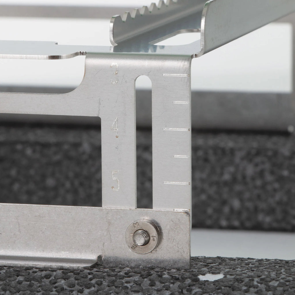Floating Straw Rack,"Metal rack side detail with height adjustment slots"