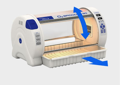 O2 Brooder by Rcom USA,"Open brooder unit with pull-out tray and blue directional arrows"
