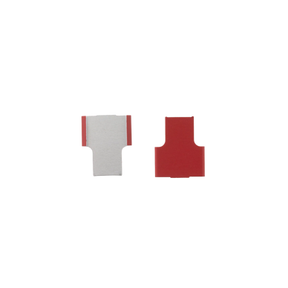 Cane Tabs,"Red and clear cane tab pieces close-up"