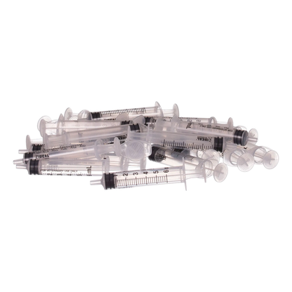 Small Syringes without Needles,"Pile of clear plastic syringes without needles"