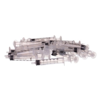 Small Syringes without Needles,"Scattered pile of clear plastic syringes without needles"