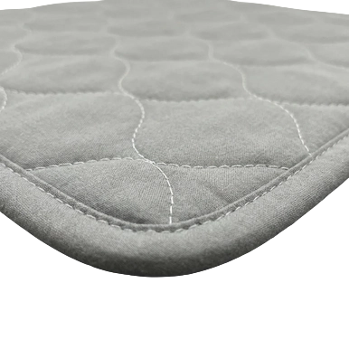 Puppywarmer Whelping Box Pad,"Close-up of quilted gray pad corner"
