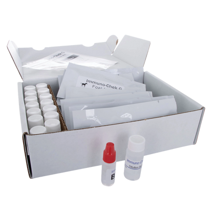 IgG Immunocheck,"Open test kit box with capped vials, packets, and two reagent bottles"