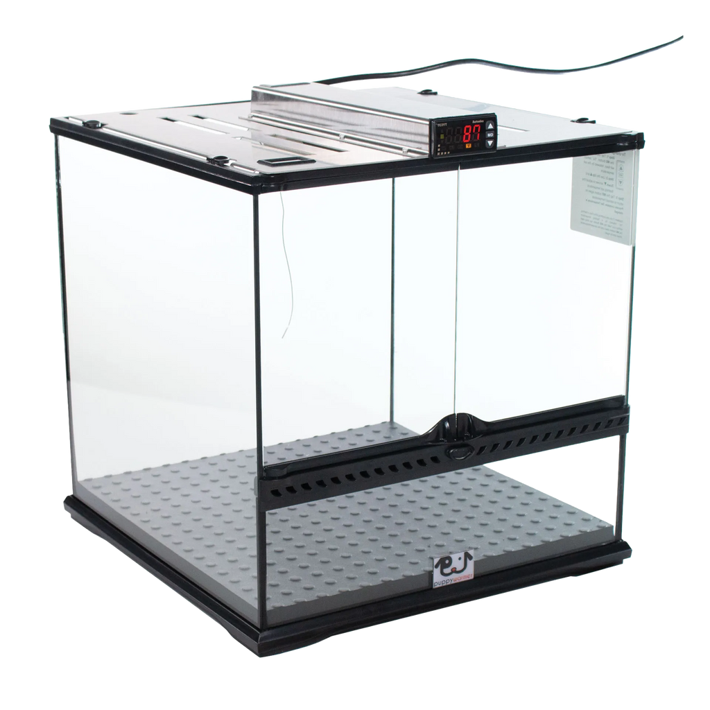 Puppywarmer® Puppy Incubator,"Clear glass incubator with metal top and gray floor mat"