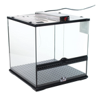 Puppywarmer® Puppy Incubator,"Clear glass incubator with metal top and gray floor mat"