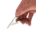 Skin Stapler,"Metal stapler held in hand, close-up view"