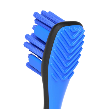 BrushMate Premium Toothbrush,"Close-up of blue toothbrush head with textured back"