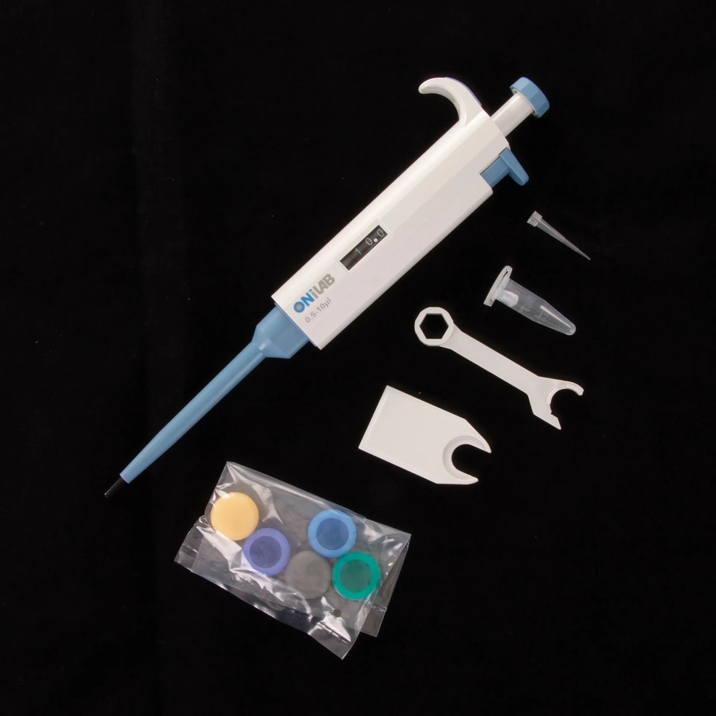 Pipette, .5-10ul,"White and blue pipette with tip, tube, wrench, and spare caps"