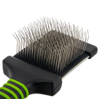 Mini Slicker Brush,"Close-up of brush head with bent metal pins"