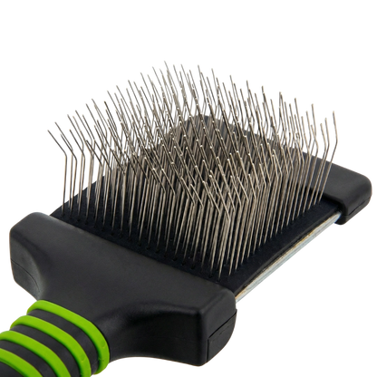 Mini Slicker Brush,"Close-up of brush head with bent metal pins"