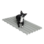 Kennel Deck®,"Gray slatted kennel deck with dog lying on top"