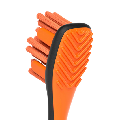 BrushMate Premium Toothbrush,"Close-up of orange toothbrush head with angled bristles"