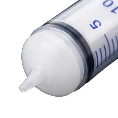 Puppywamer Latchons Syringe Nipple Feeders,"Close-up of syringe tip with white nipple attachment"