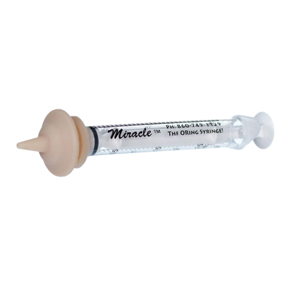 The Miracle Nipple® for Kittens, Puppies, and Small Mammals,"Clear feeding syringe with beige rubber nipple attachment"