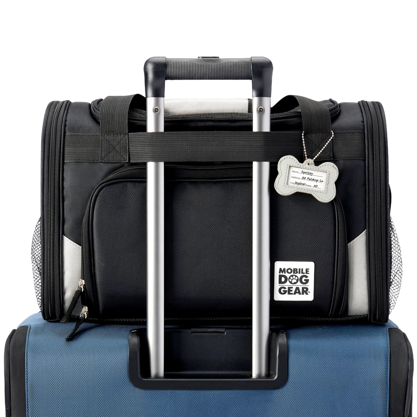 Mobile Dog Gear Pet Carrier Plus,"Black pet carrier attached to luggage handle with bone-shaped ID tag"
