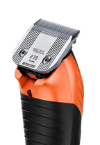 KM Velocity Clipper,"Orange and black clipper with metal blade close-up"