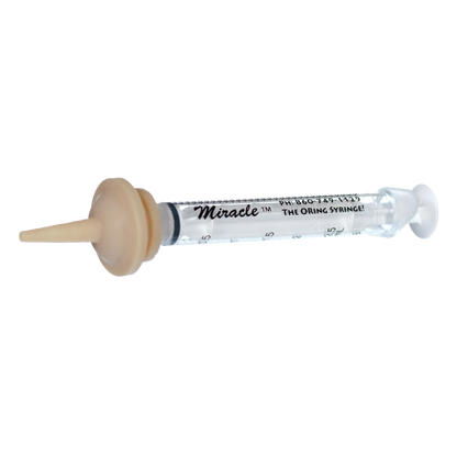 "The Miracle Nipple® for Kittens, Puppies, and Small Mammals","Clear syringe with beige feeding nipple attached"