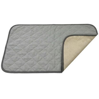 Puppywarmer Incubator Pee Pad,"Gray quilted pee pad with corner folded back"