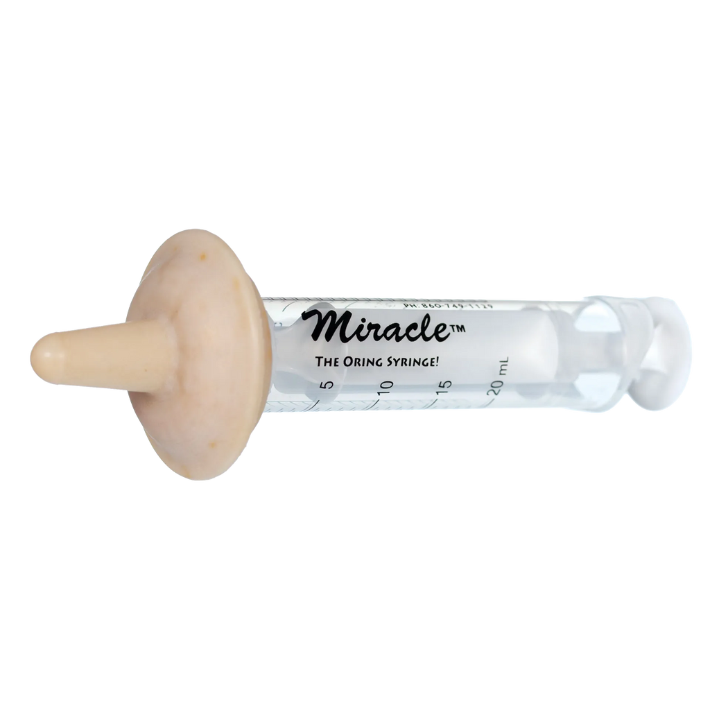 The Miracle Nipple® for Puppies,"Clear feeding syringe with beige nipple attachment"