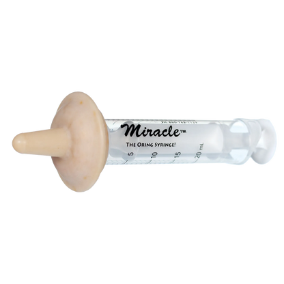 The Miracle Nipple® for Puppies,"Clear feeding syringe with beige nipple attachment"